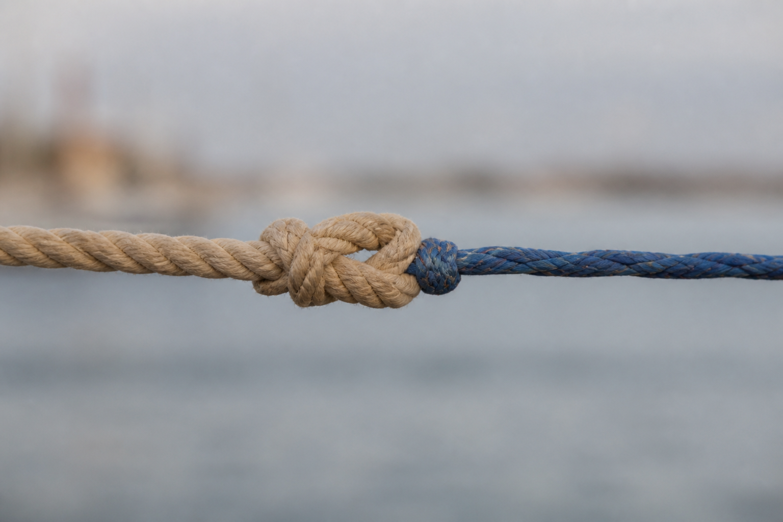 Two ropes of different thickness joined together end to end